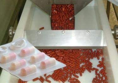 Transferencia mecánica de cápsulas farmacéuticas Transferencia mecánica de cápsulas farmacéuticas
