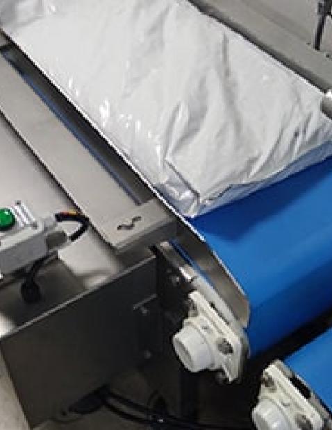 Convoyeur à bande sur conditionneuse de sacs 